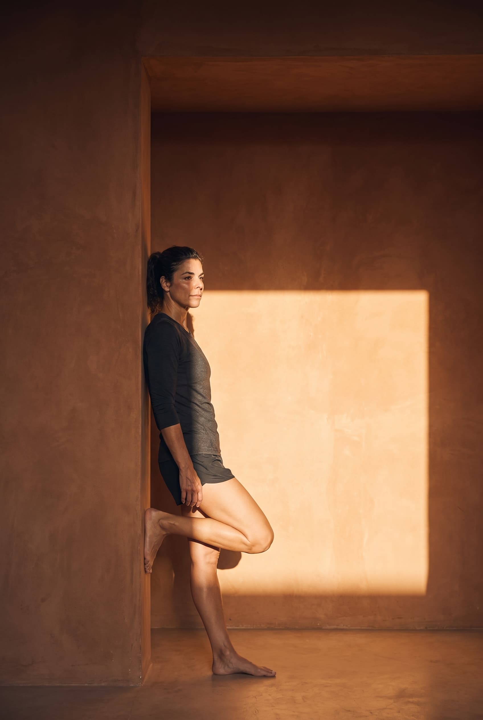 Athlete stretching on a blue court beside a Rebody BPC-157 vial